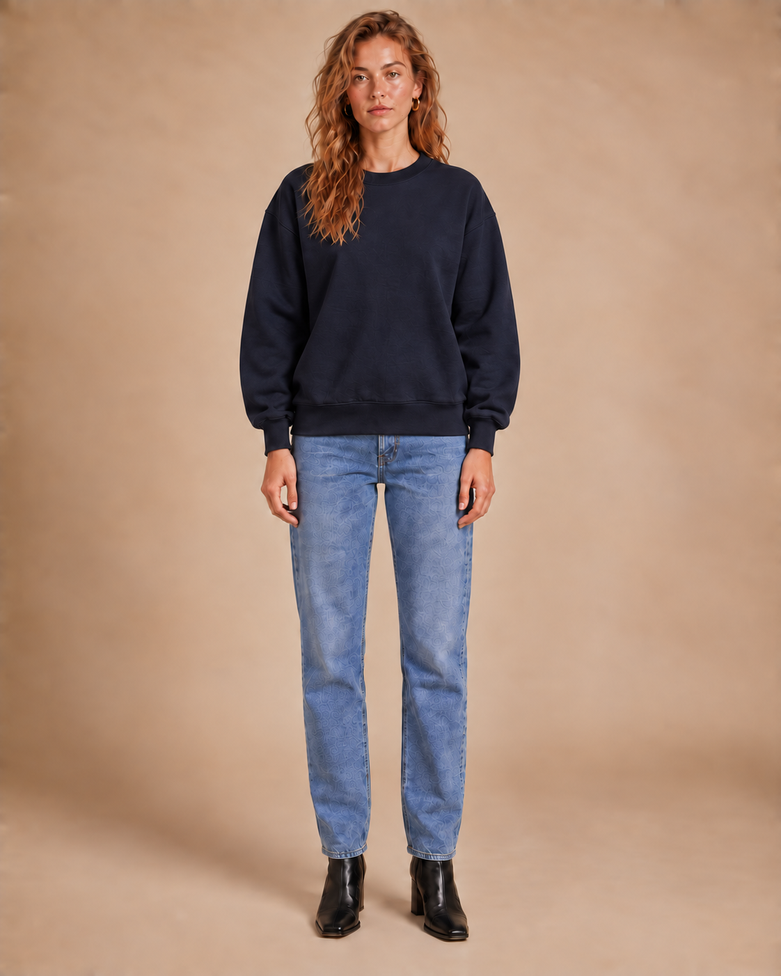 Model wearing an oversized Vintemod sweatshirt in a neutral studio setting